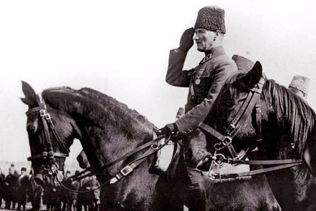 Mustafa Kemal Atatürk on horseback, saluting